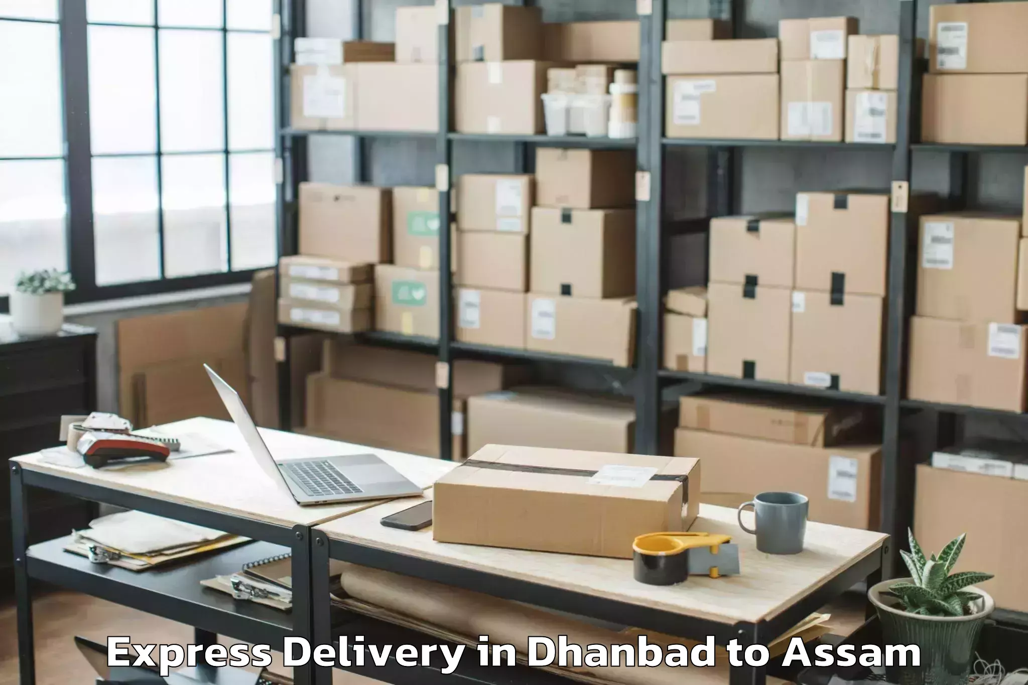 Book Dhanbad to Morigaon Express Delivery Online